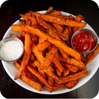 A photo of sweet potato fries on a plate